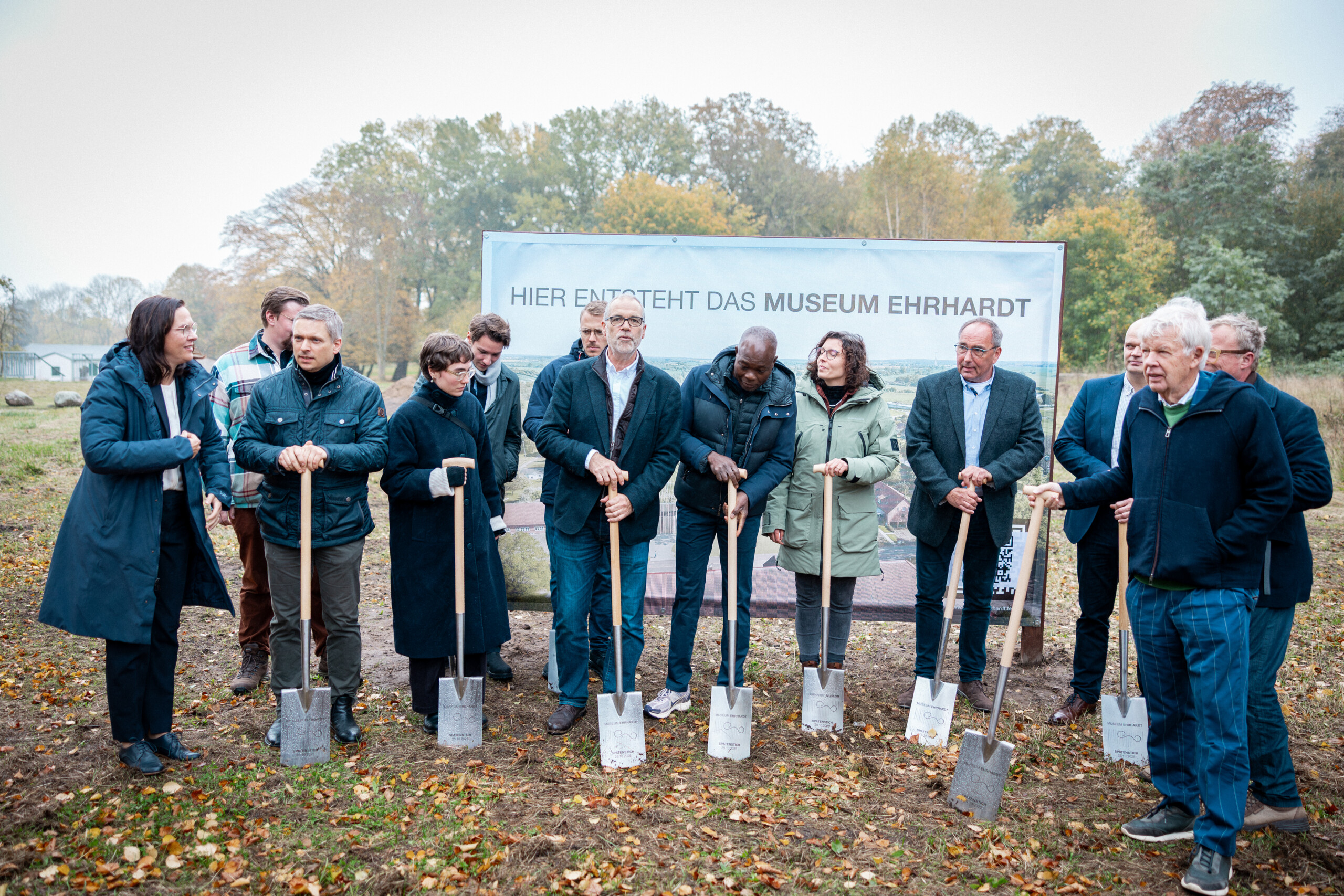 Group photo of people with spades to mark build of new Ehrhardt Museum