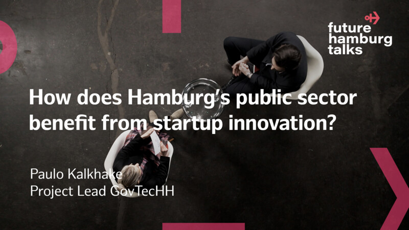 Two people seated in chairs having a discussion about Hamburg's public sector and startup innovation.