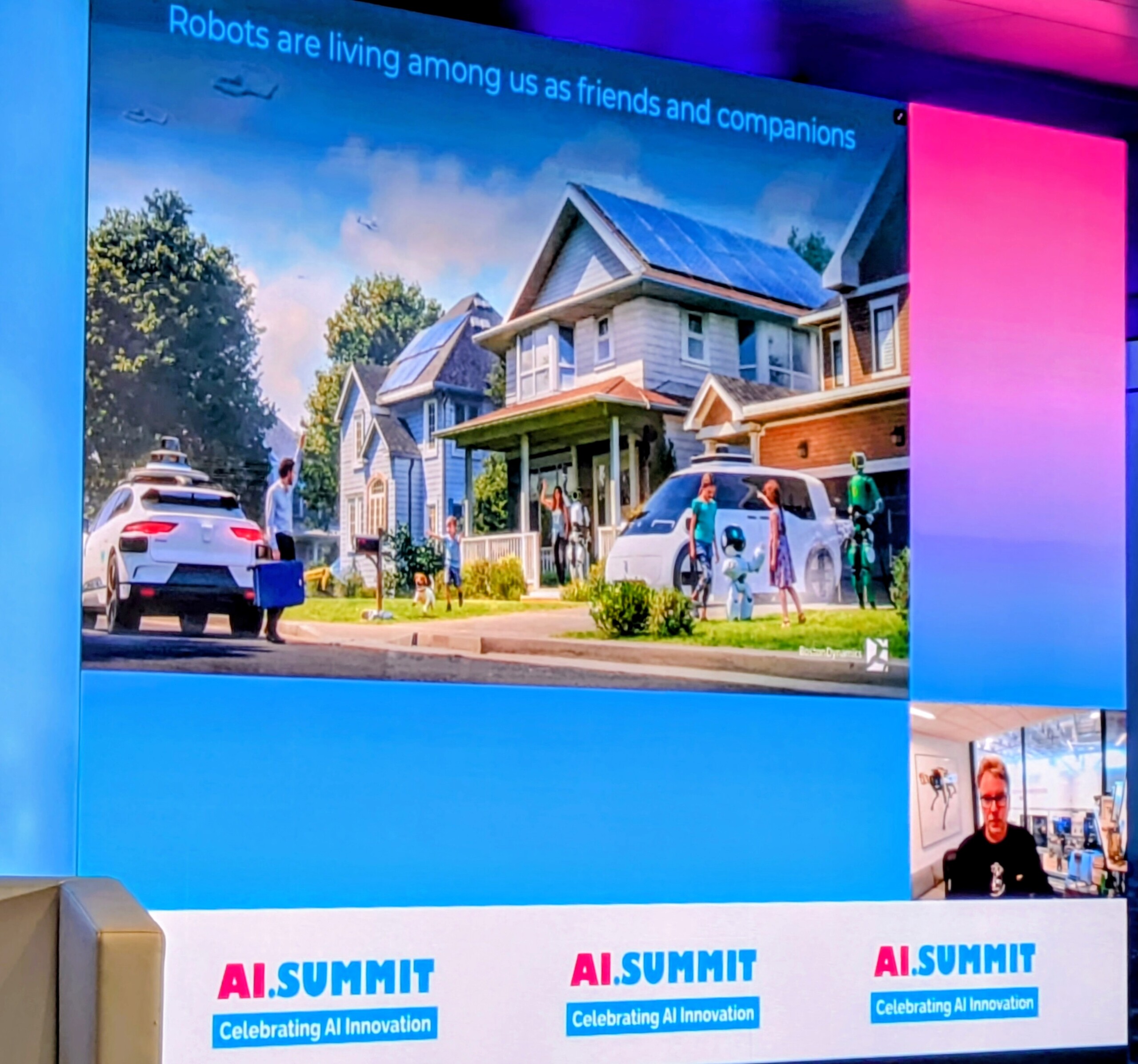 View of a suburb with people, robots and driverless vehicles presented during summit