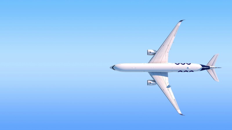 Passagierflugzeug von oben vor klarem blauem Himmel fliegend.