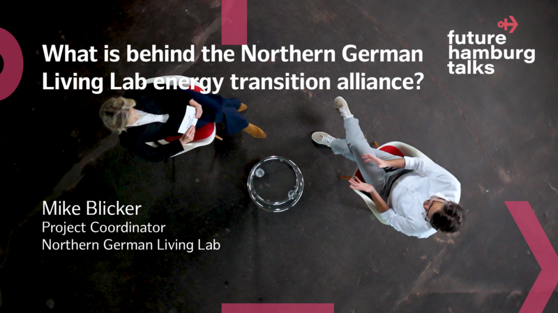 Overhead view of two people seated in a discussion about Northern German Living Lab 