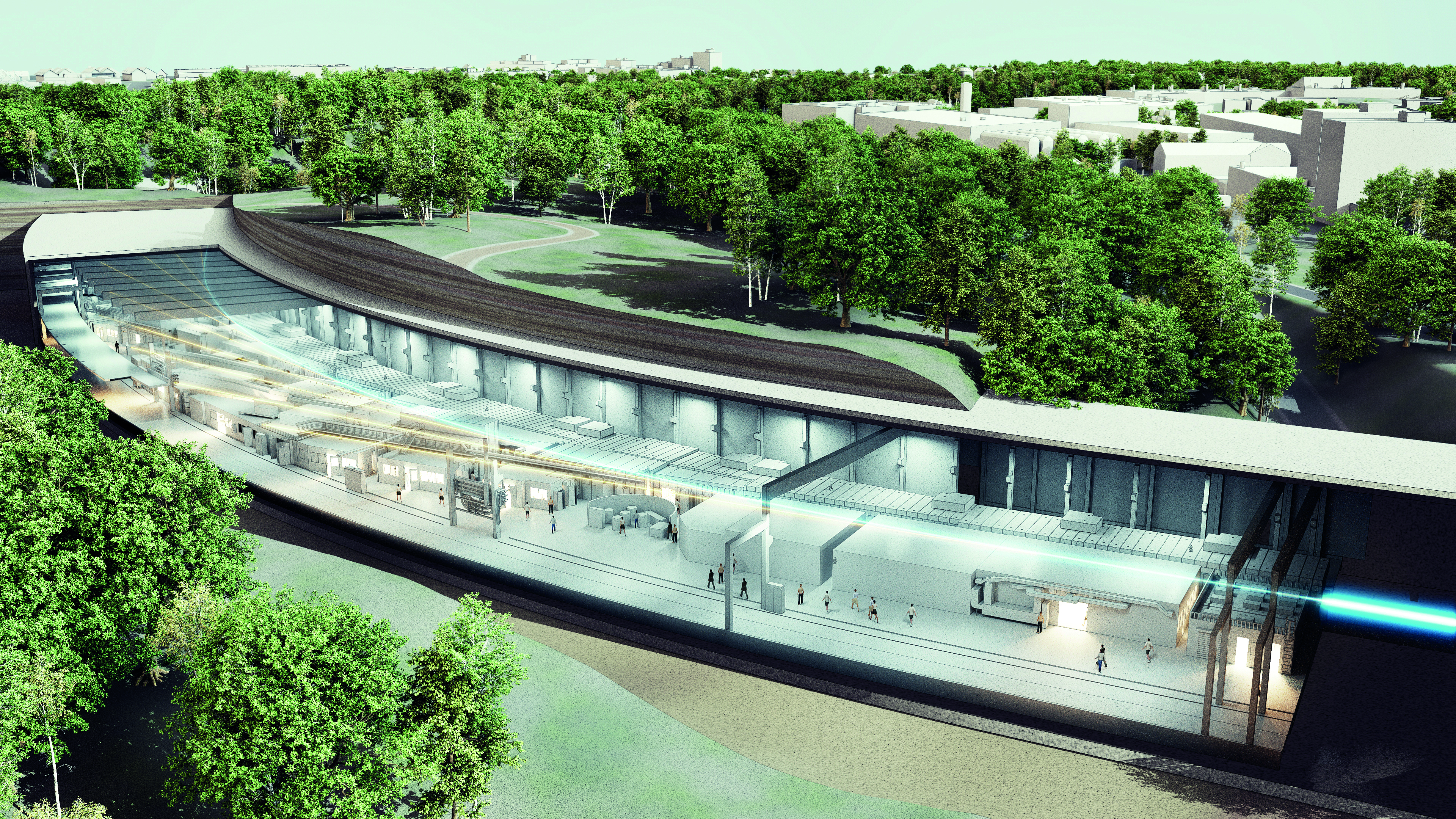 Sectional view of an underground particle accelerator with surrounding forest and buildings.