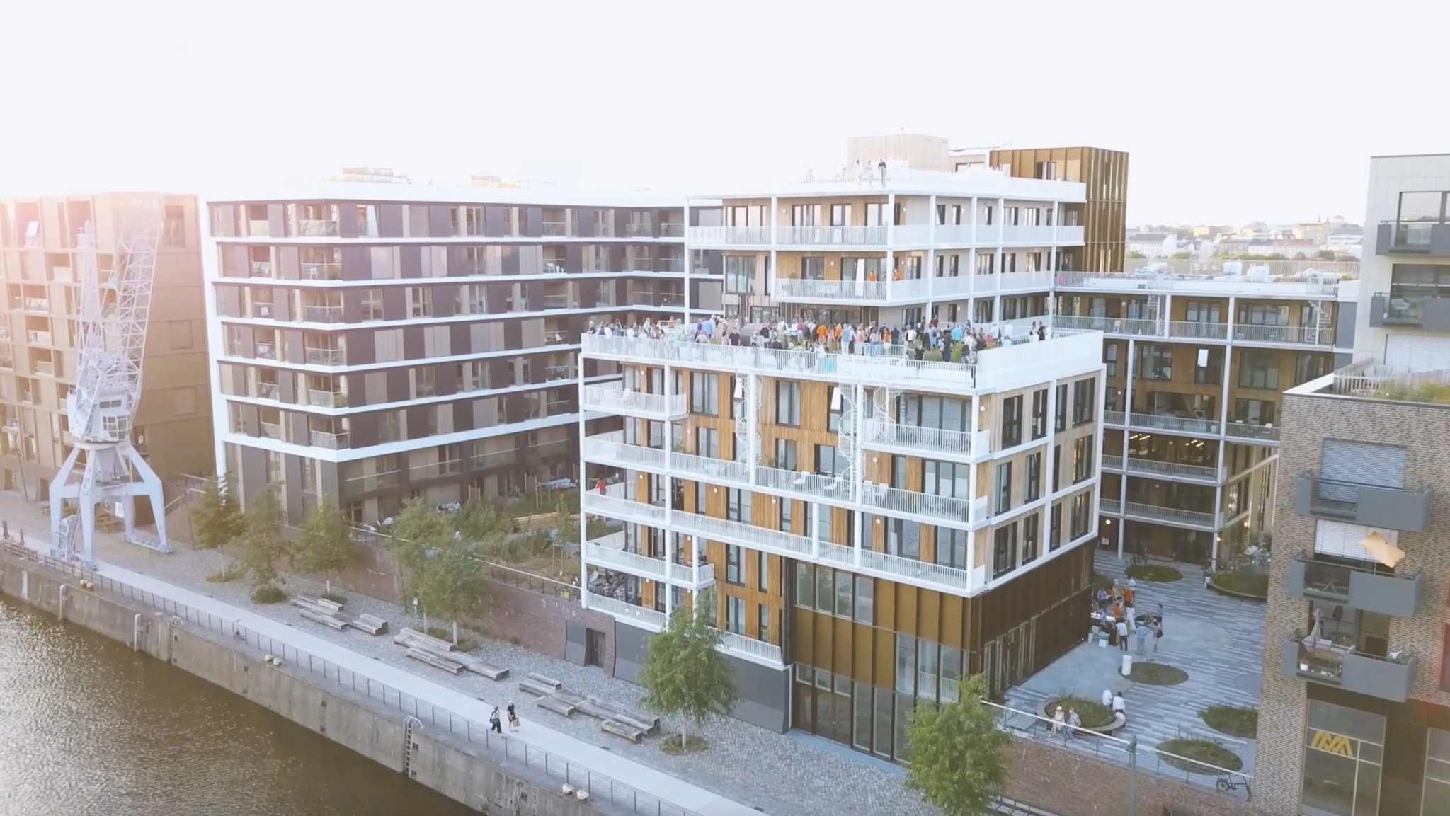 Modern residential building with rooftop terrace in port