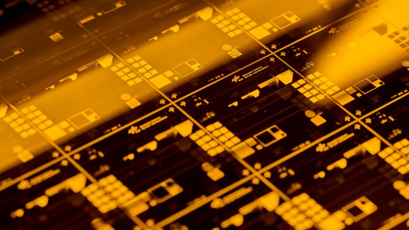 Close-up of microchips with complex circuits and symbols