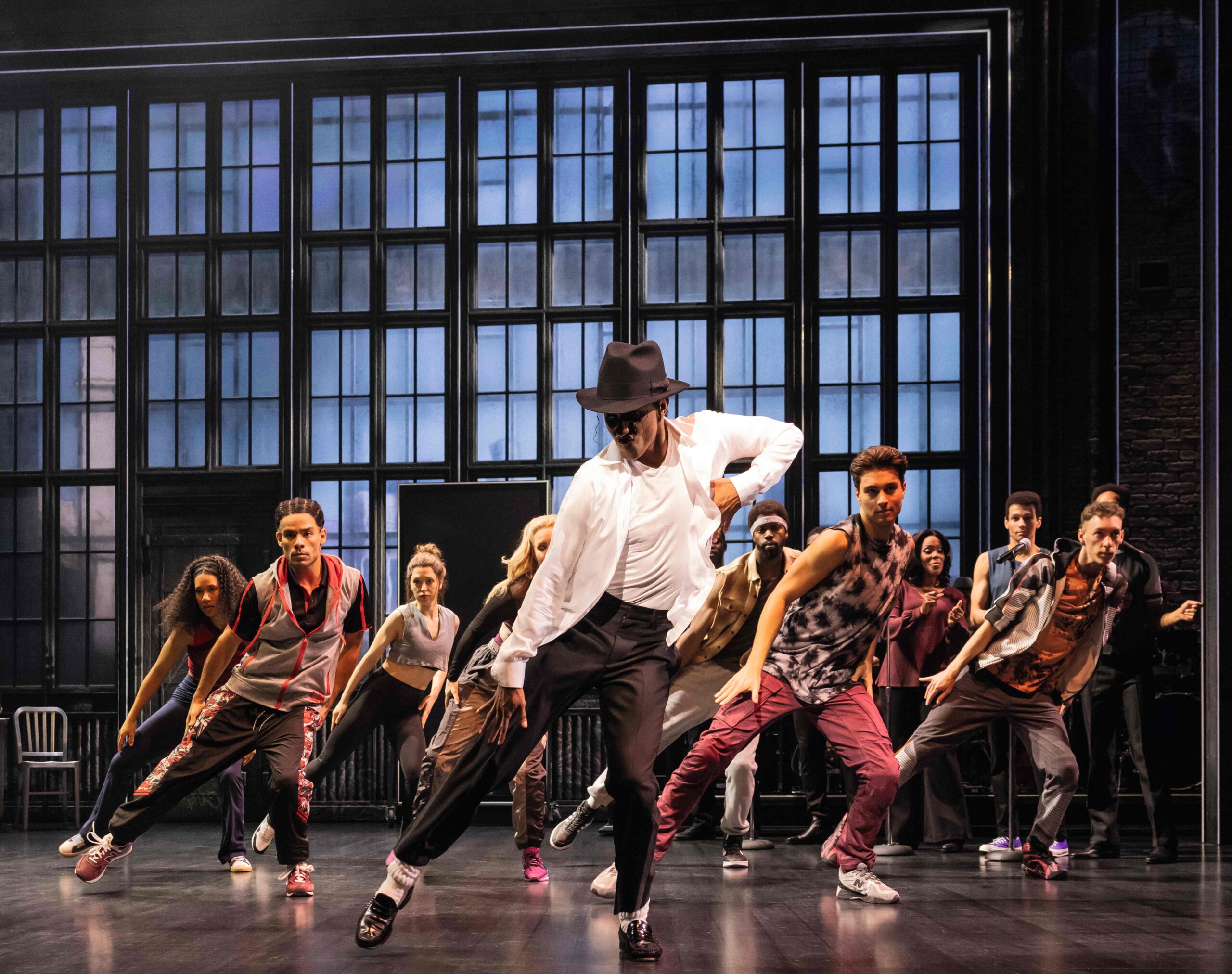 Dance scene with Benét Monteiro as Michael Jackson in the foreground and another 10 dancers behind him