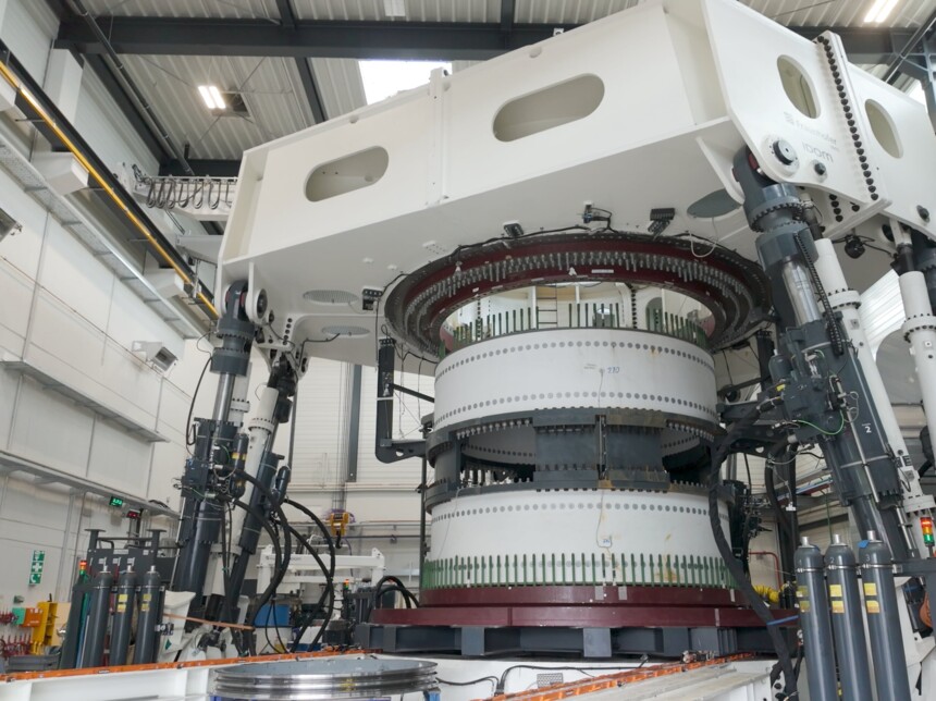 Interior view of the Fraunhofer IWES Large Bearing Laboratory in Hamburg, a testing facility for large rolling bearings used in wind turbines.