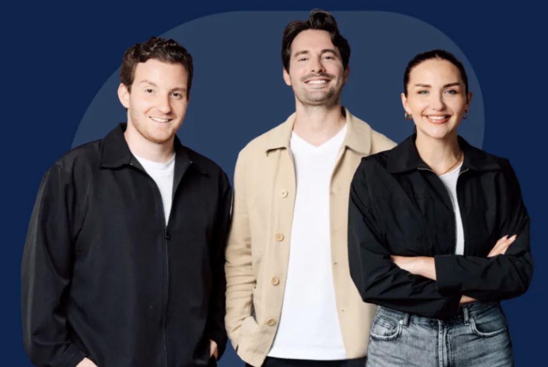 Two men and a woman in front of a blue background